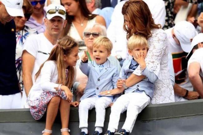 Leo Federer with his twin brother, sister, and mother, Mirka Federer.